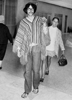 An air traveler wears a poncho at San Francisco International Airport. Sept.1970. Morgue01